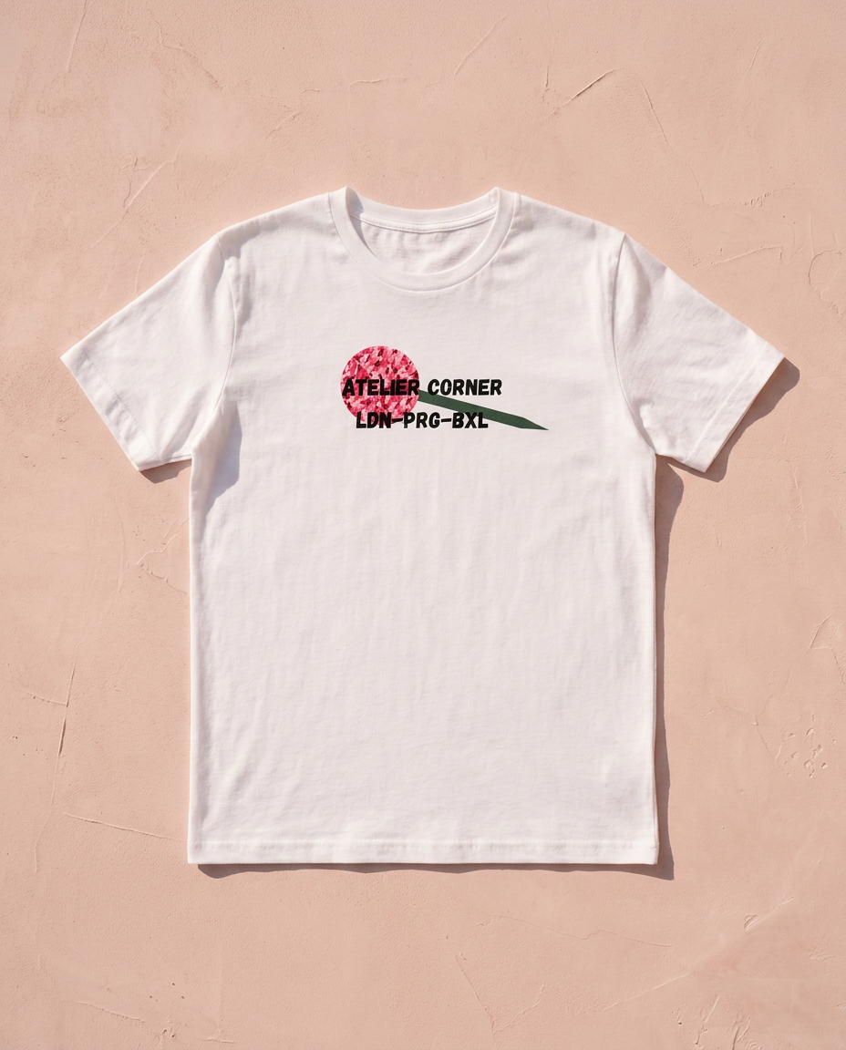 White Atelier Corner t-shirt with a pink camo disc print, flat-laid on a blush surface
