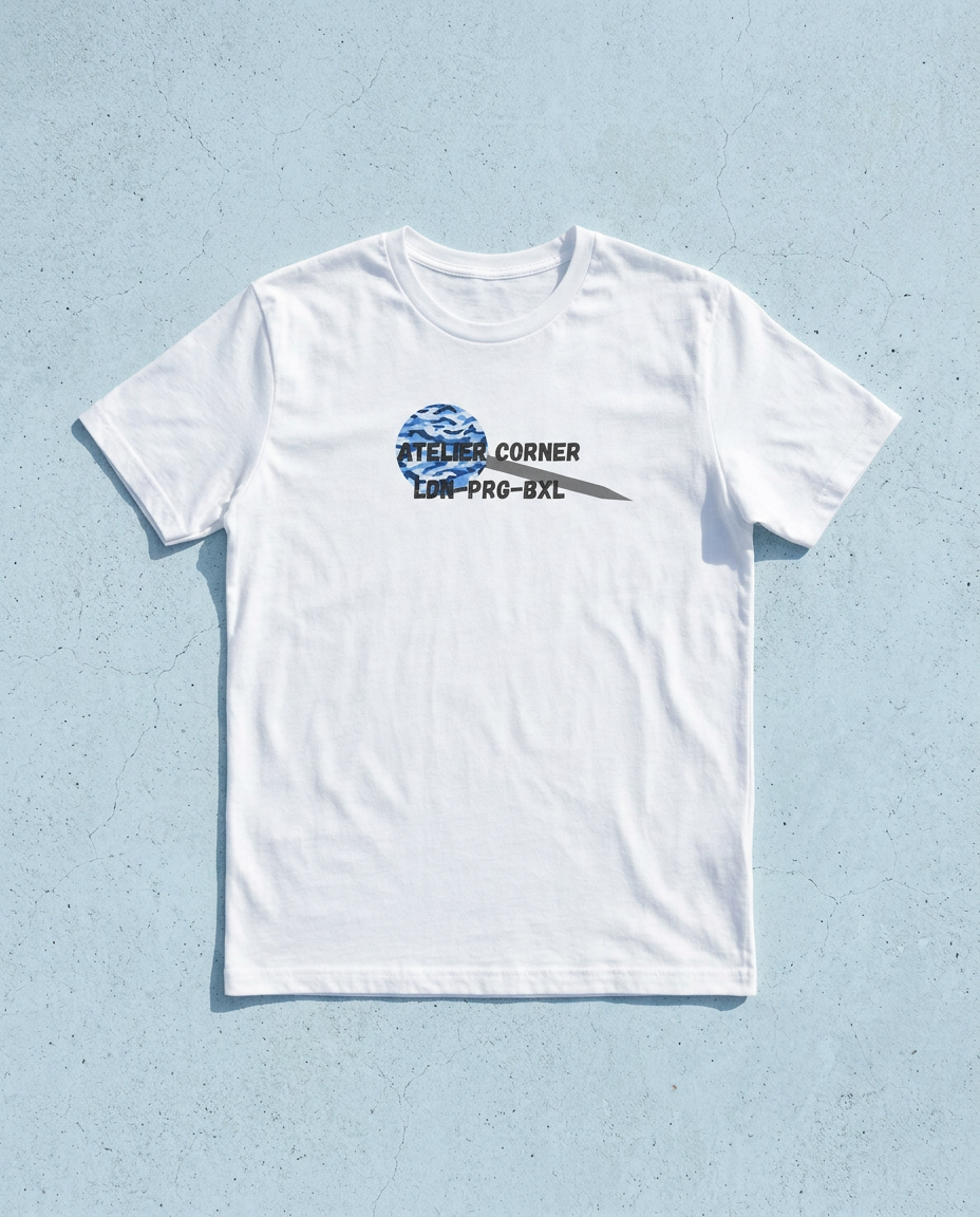 White Atelier Corner t-shirt with a blue camo disc print, flat-laid on a pale blue surface